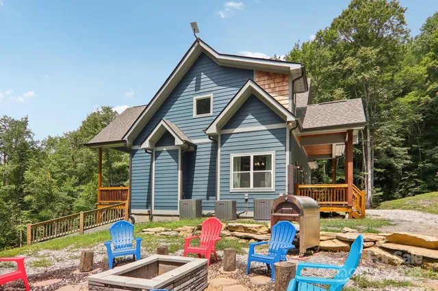 a blue and white house with outdoor seating