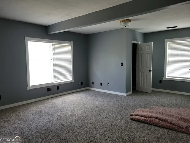 an empty room with windows