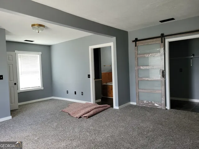 a bathroom with a bathtub and a window