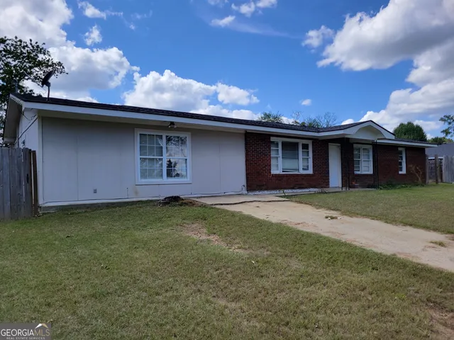 a backyard of a house with lots of green space