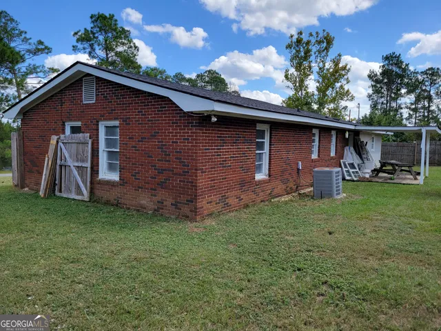 a backyard of a house with lots of green space