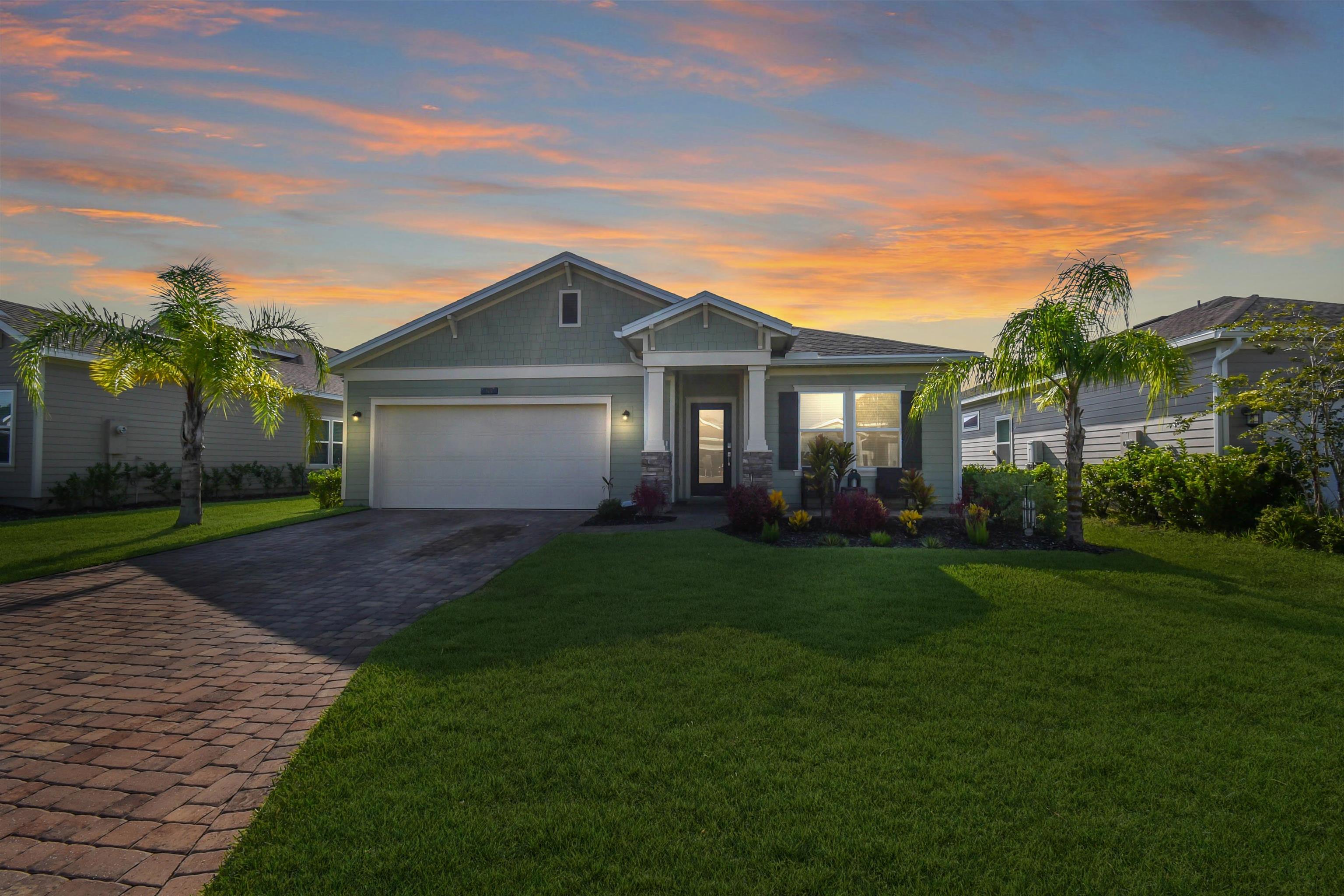 53 Cloverly Point St. Augustine, FL 32092 - Photo 1 of 51 a view of a yard in front of a house with large windows