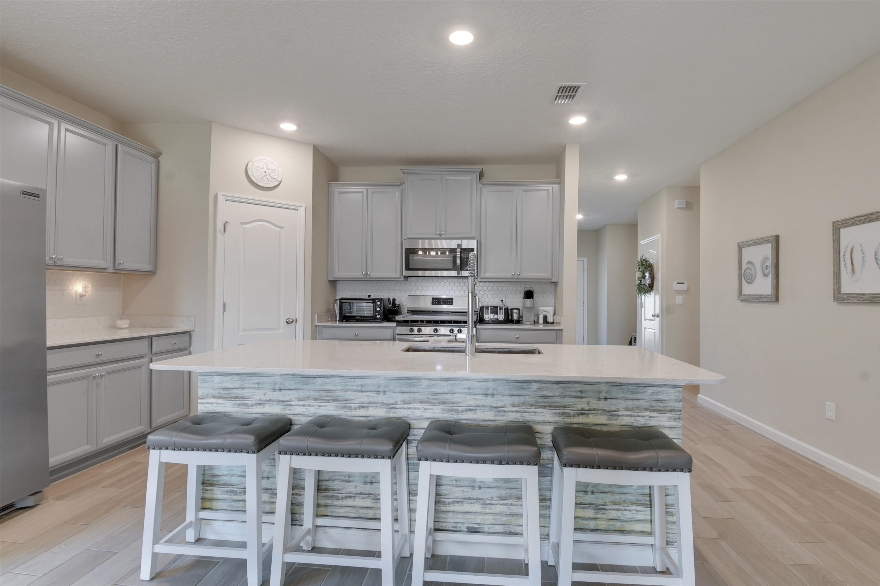 53 Cloverly Point St. Augustine, FL 32092 - Photo 13 of 51 a kitchen with kitchen island granite countertop counter top space cabinets and stainless steel appliances