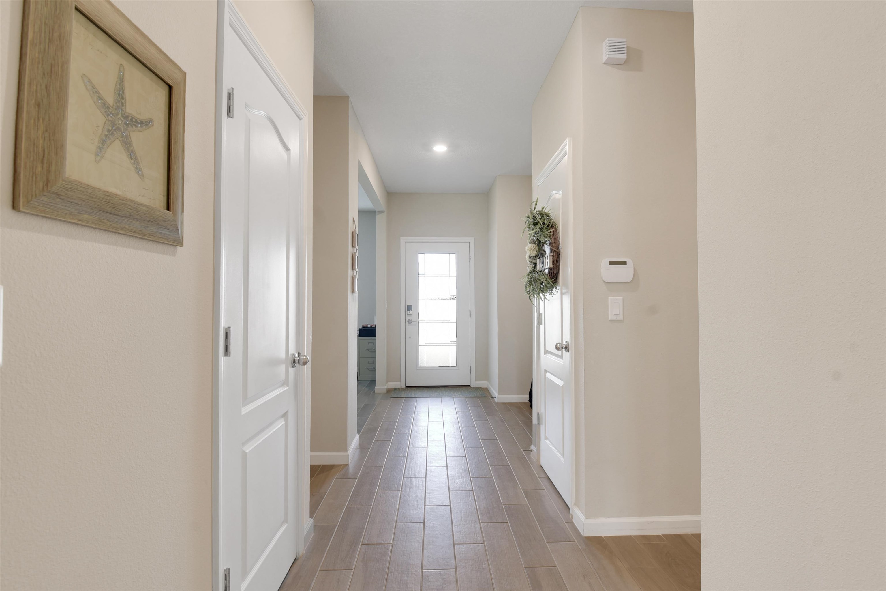 53 Cloverly Point St. Augustine, FL 32092 - Photo 16 of 51 a view of a hallway with wooden floor and closet