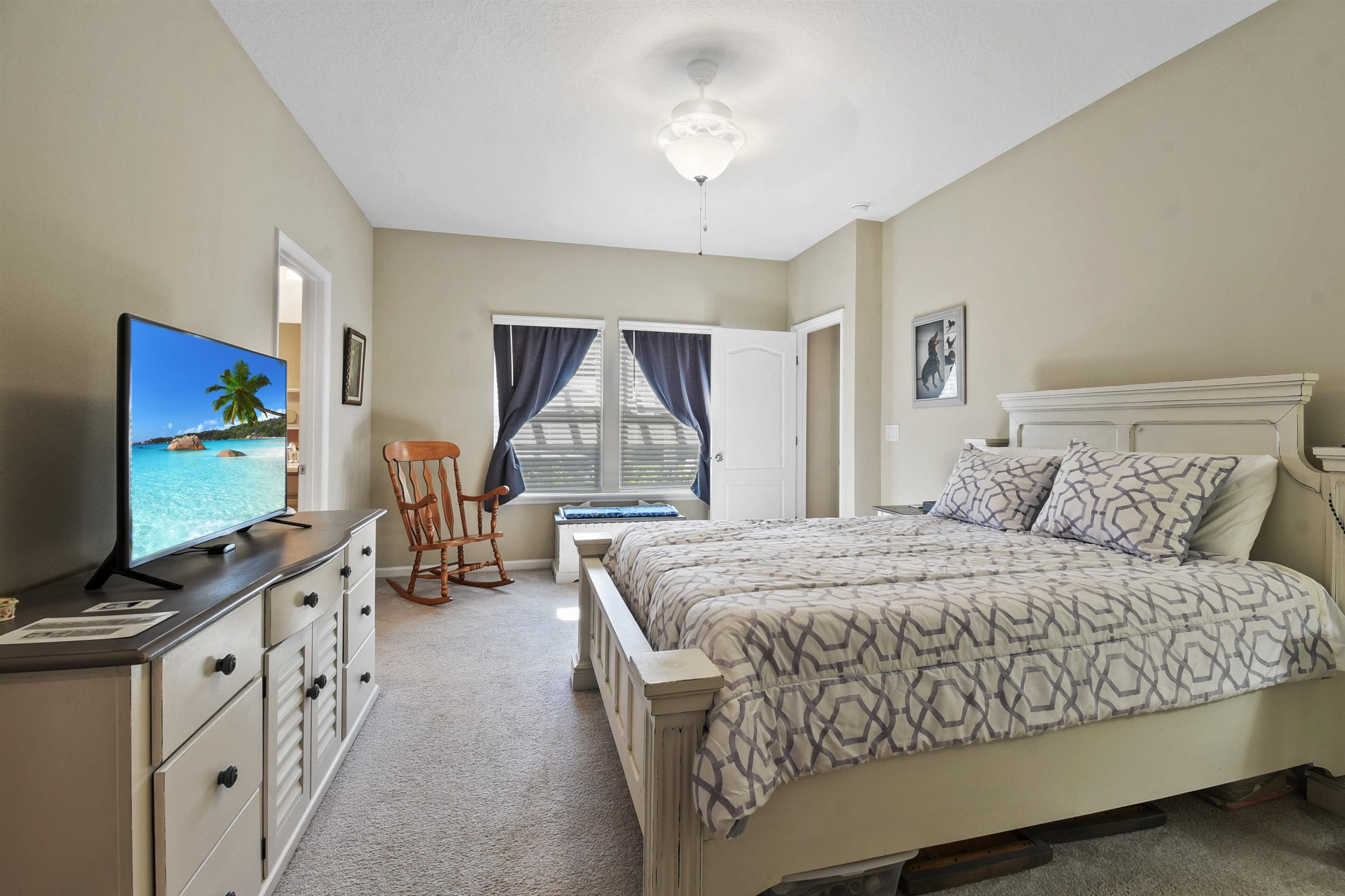 53 Cloverly Point St. Augustine, FL 32092 - Photo 21 of 51 a bedroom with a large bed and a flat screen tv