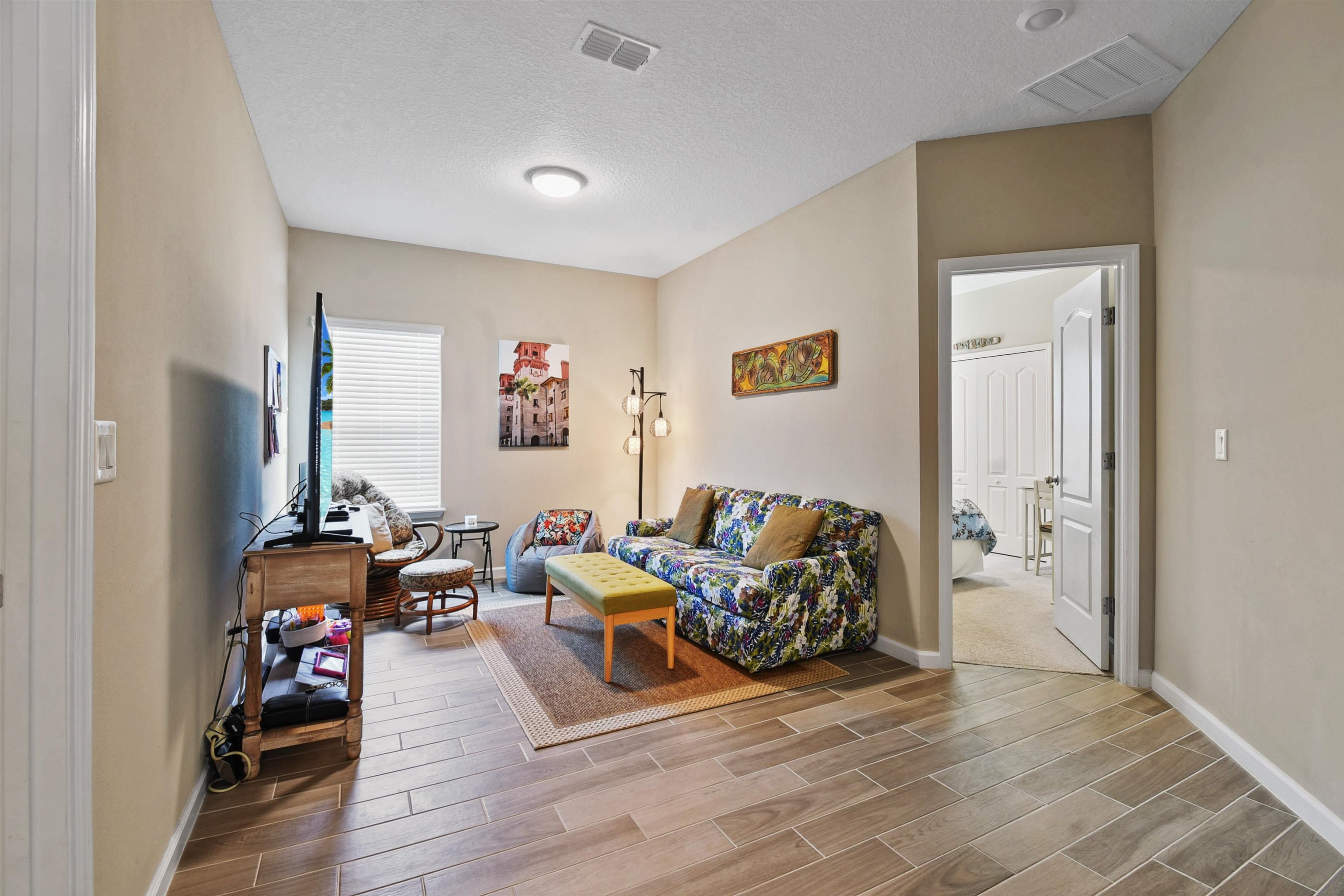 53 Cloverly Point St. Augustine, FL 32092 - Photo 26 of 51 a living room with furniture and a flat screen tv