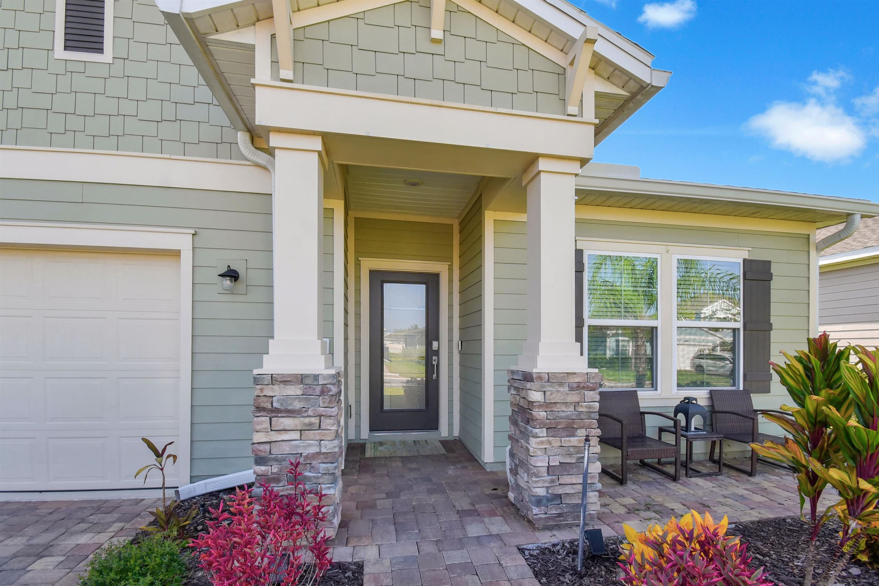 53 Cloverly Point St. Augustine, FL 32092 - Photo 3 of 51 a front view of a house with outdoor seating