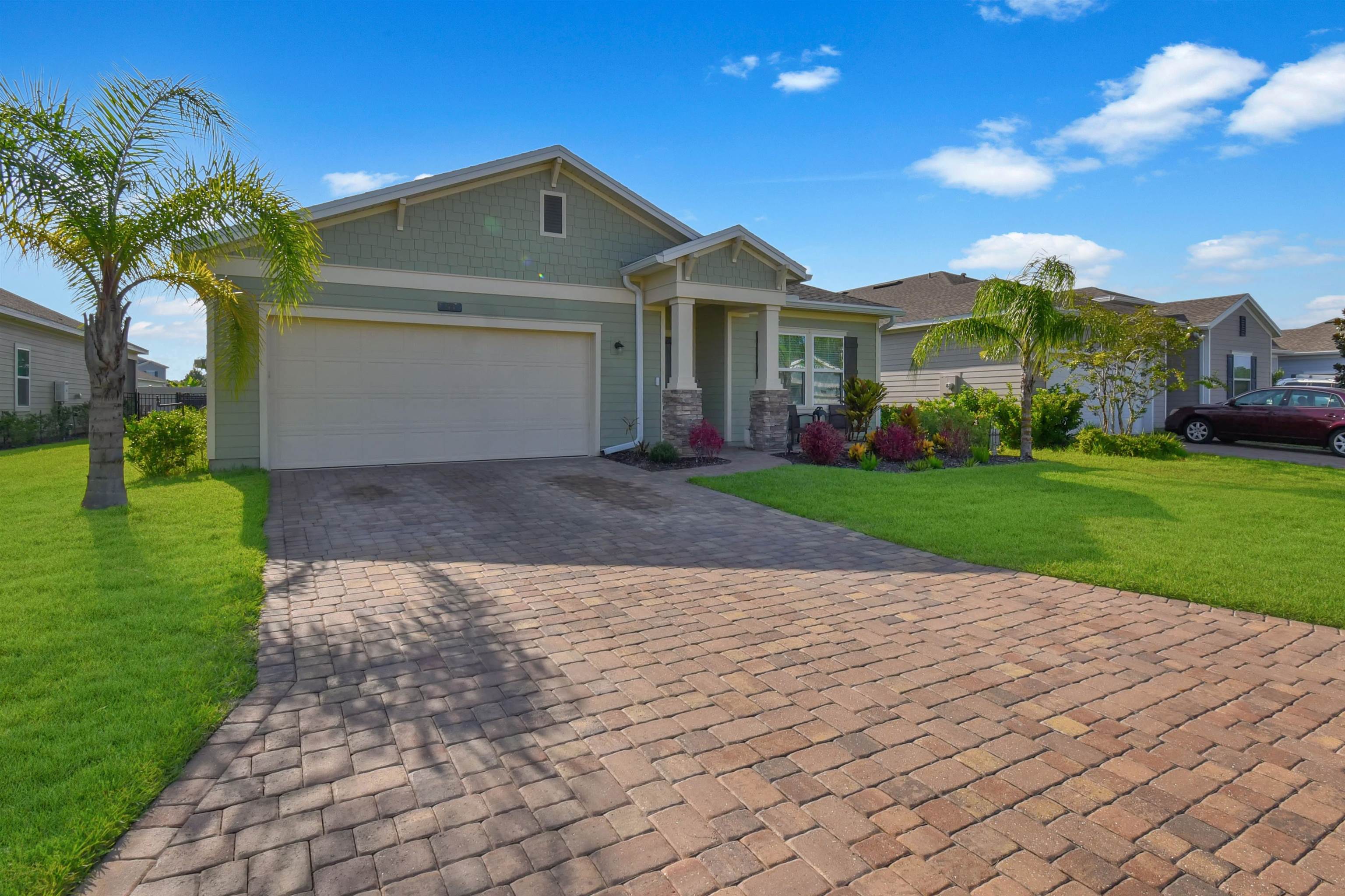 53 Cloverly Point St. Augustine, FL 32092 - Photo 4 of 51 a front view of a house with a yard and garage