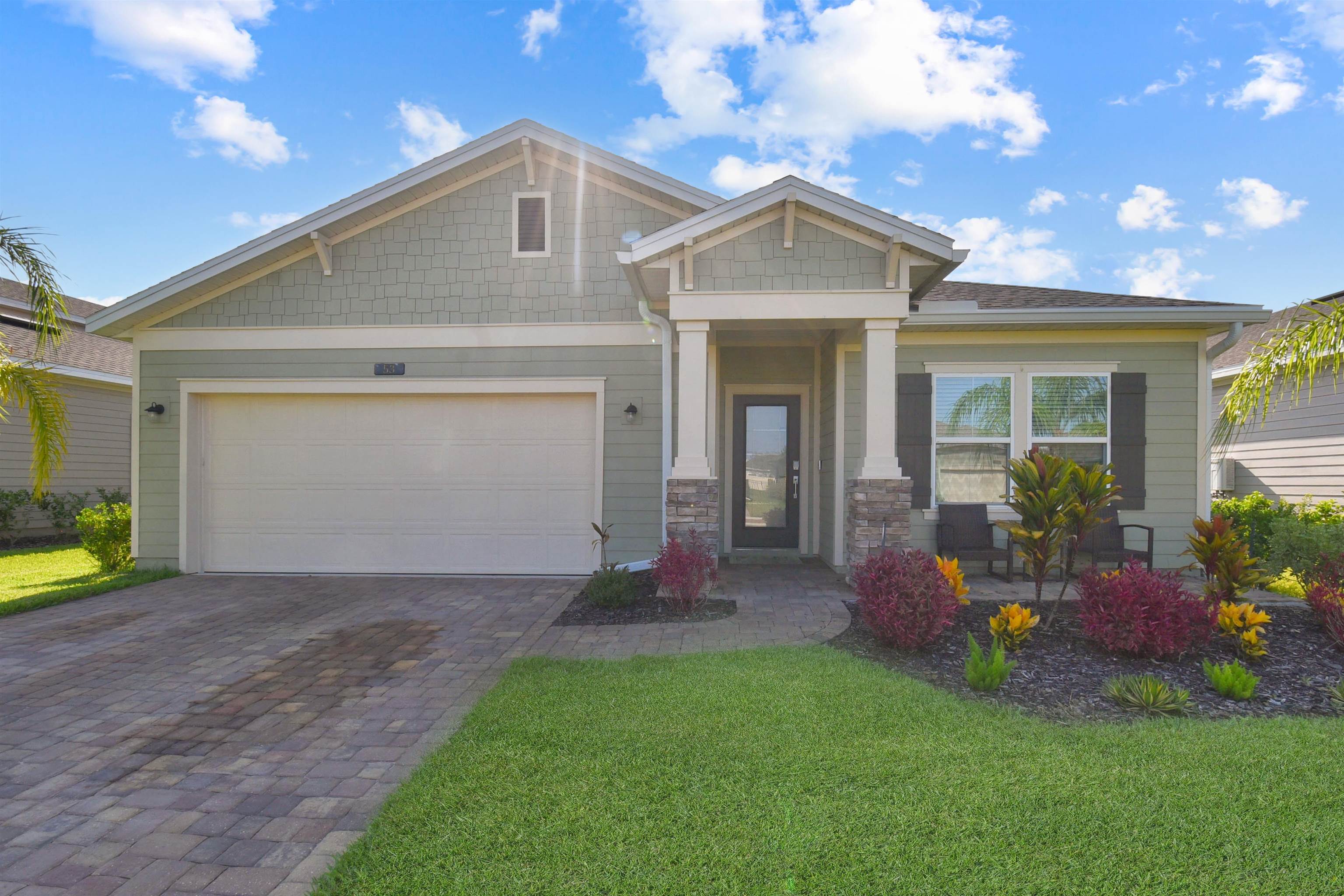 53 Cloverly Point St. Augustine, FL 32092 - Photo 5 of 51 a front view of a house with a yard and garage