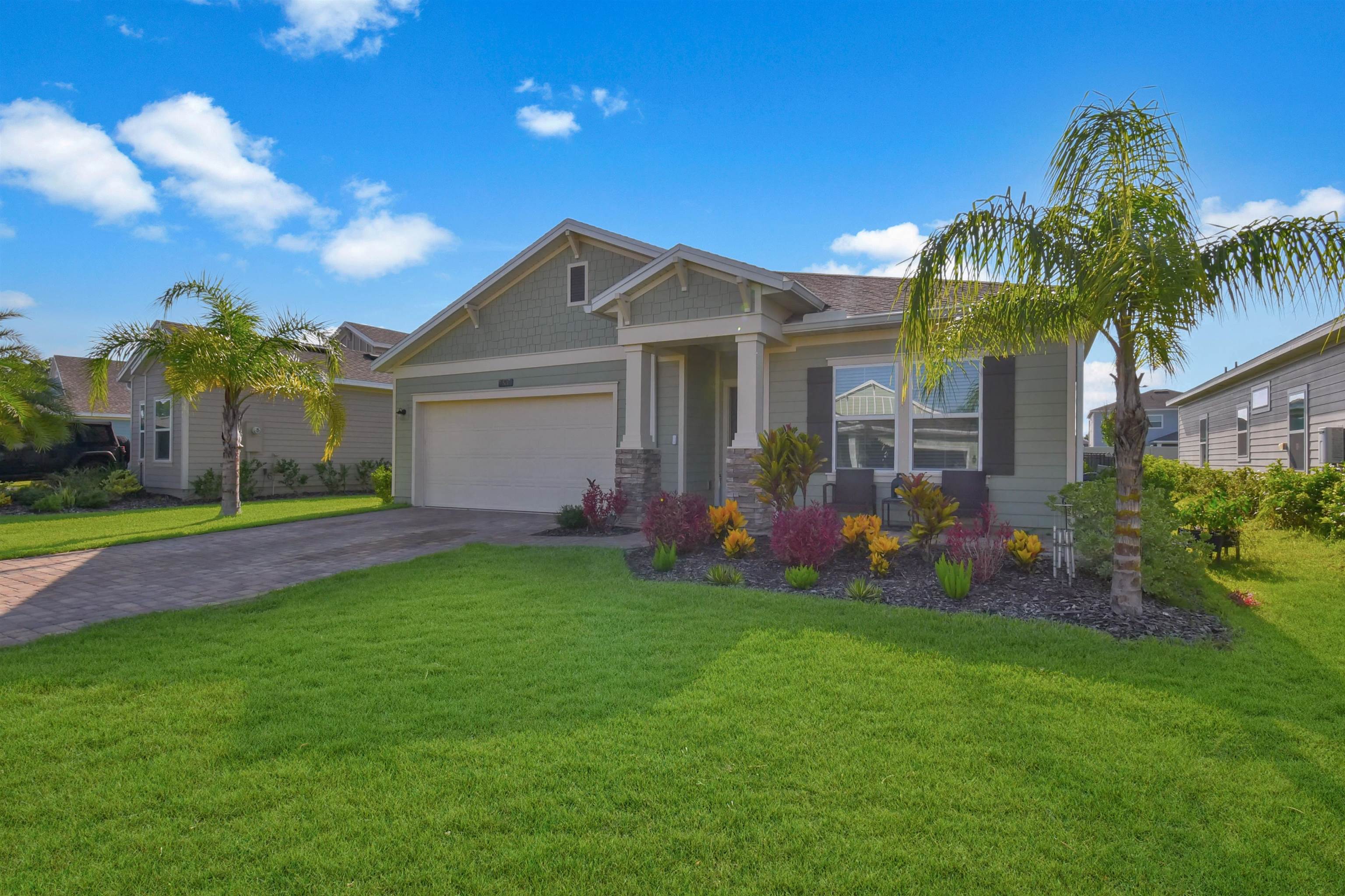 53 Cloverly Point St. Augustine, FL 32092 - Photo 6 of 51 a front view of house with yard and outdoor seating