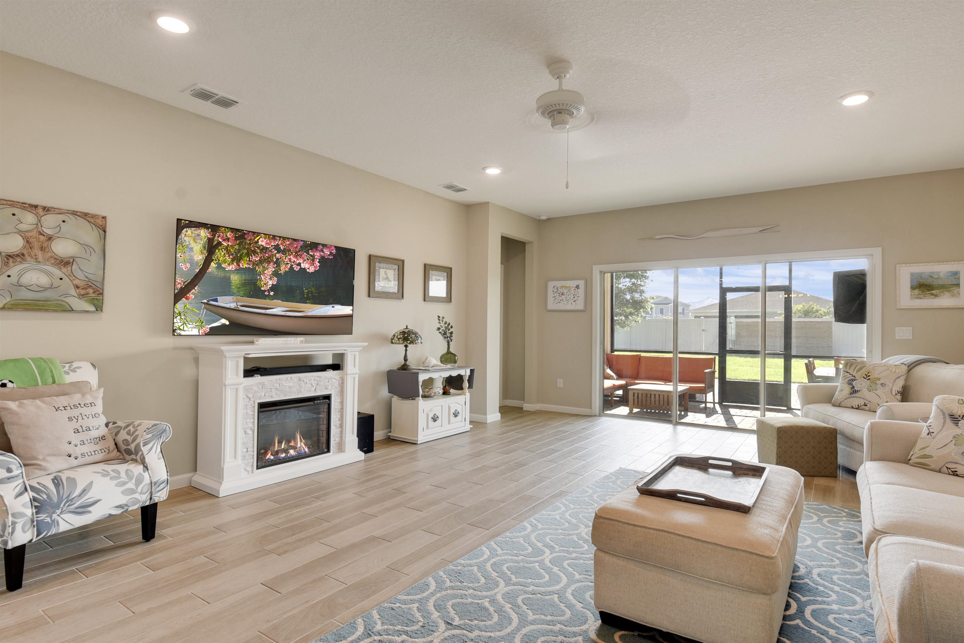 53 Cloverly Point St. Augustine, FL 32092 - Photo 8 of 51 a living room with furniture a fireplace and a flat screen tv