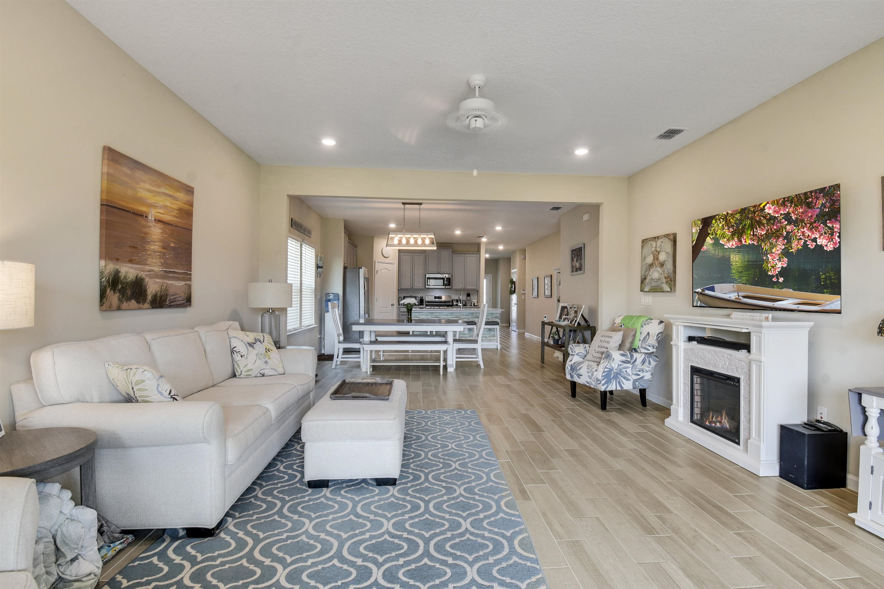 53 Cloverly Point St. Augustine, FL 32092 - Photo 9 of 51 a living room with furniture a flat screen tv and a fireplace