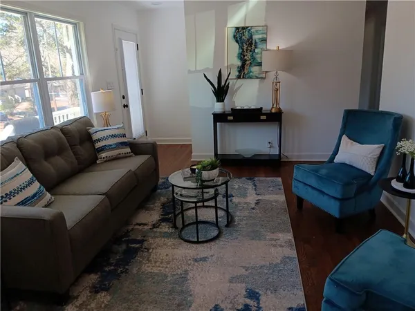 a living room with furniture and a window