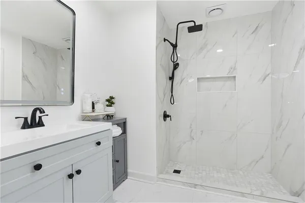 a bathroom with a bathtub and a sink