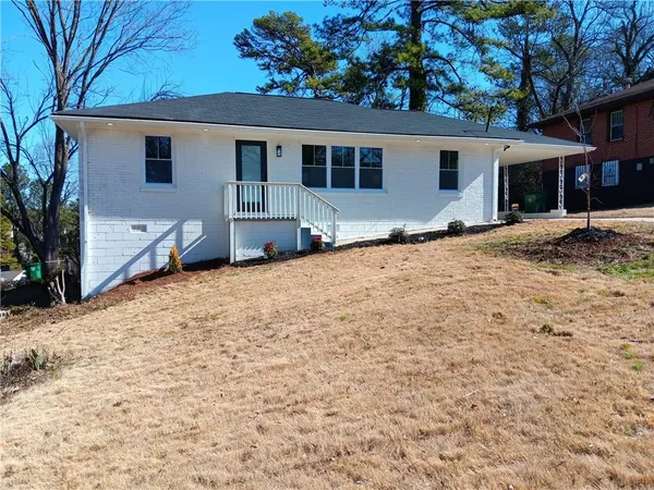a house with yard in front of it