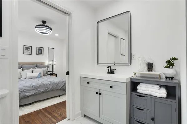 a en suite bathroom with a toilet sink and mirror