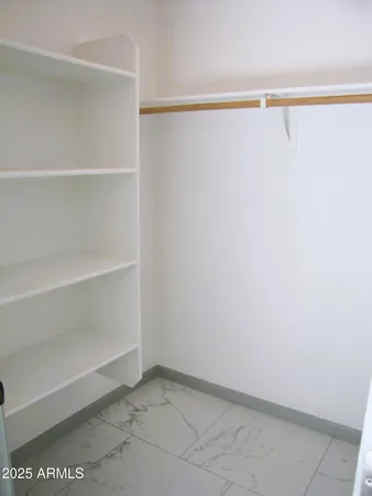 a view of an empty walk in closet