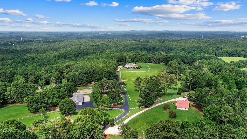 Aerial View Of The Estate.  There are 6 structures.  Manor House, Stable, Carriage House, 2 Car Garage W/ Studio Apt., 3 Car Garage & 3 Car Carport, Hay Barn.  Truly An Equestrian Lover's Dream Property! There Is Additional Land Behind The Main House That Can Not Be Seen In This Photo