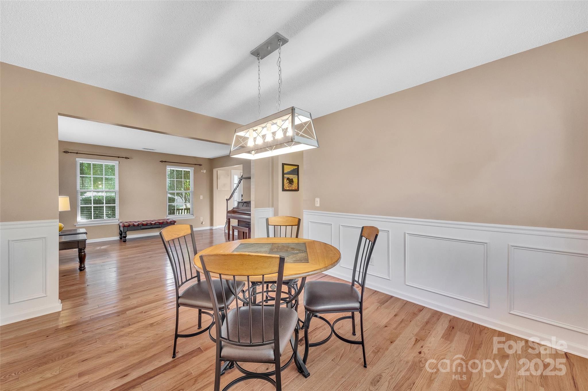 12351 Cardinal Point Road Charlotte, NC 28269 - Photo 11 of 43 a view of a dining room with furniture window and wooden floor