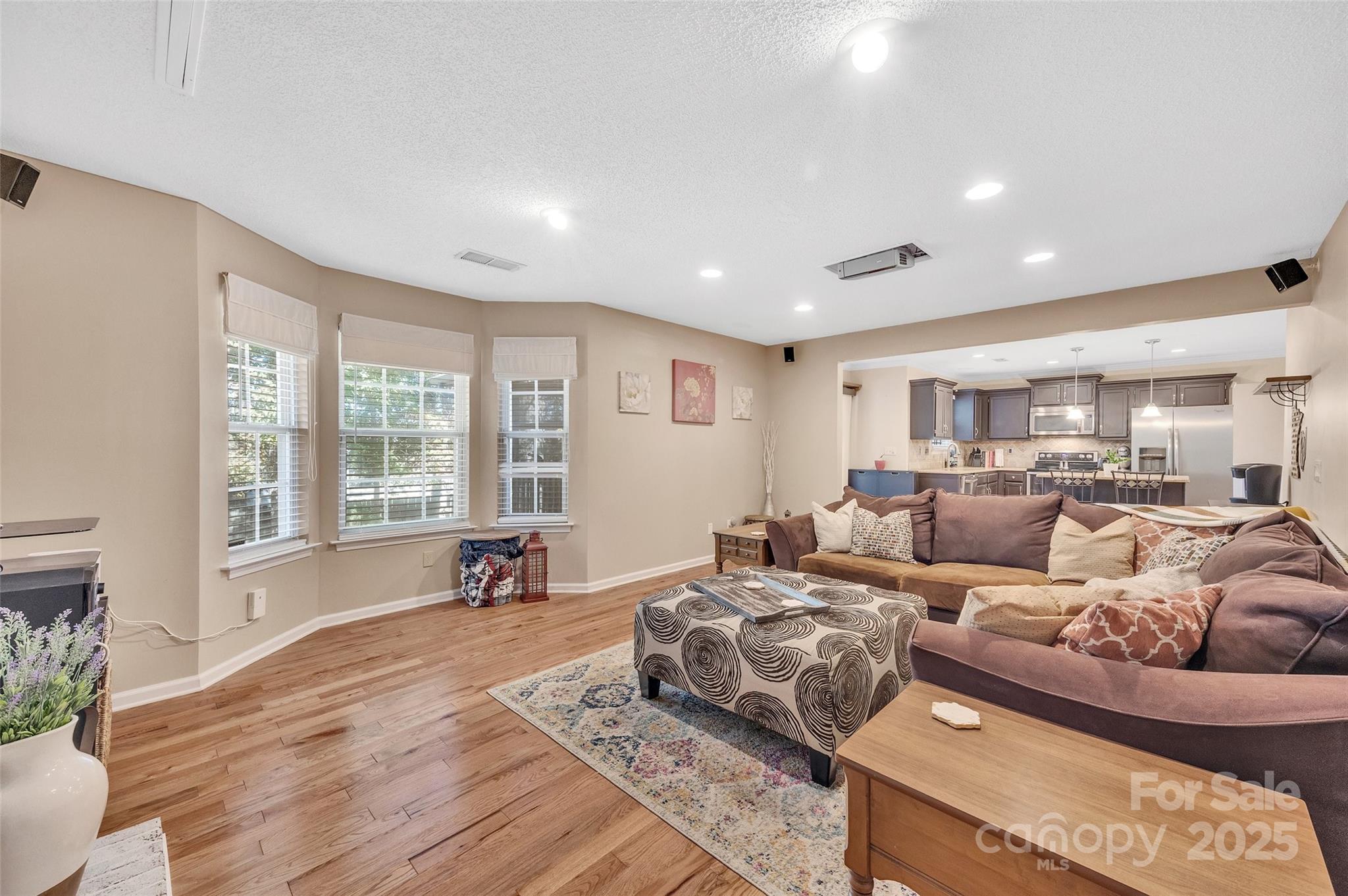 12351 Cardinal Point Road Charlotte, NC 28269 - Photo 18 of 43 a living room with furniture and a large window