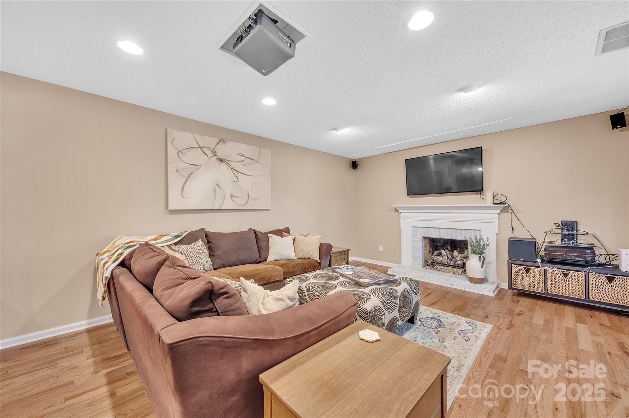 12351 Cardinal Point Road Charlotte, NC 28269 - Photo 20 of 43 a living room with furniture fireplace and flat screen tv