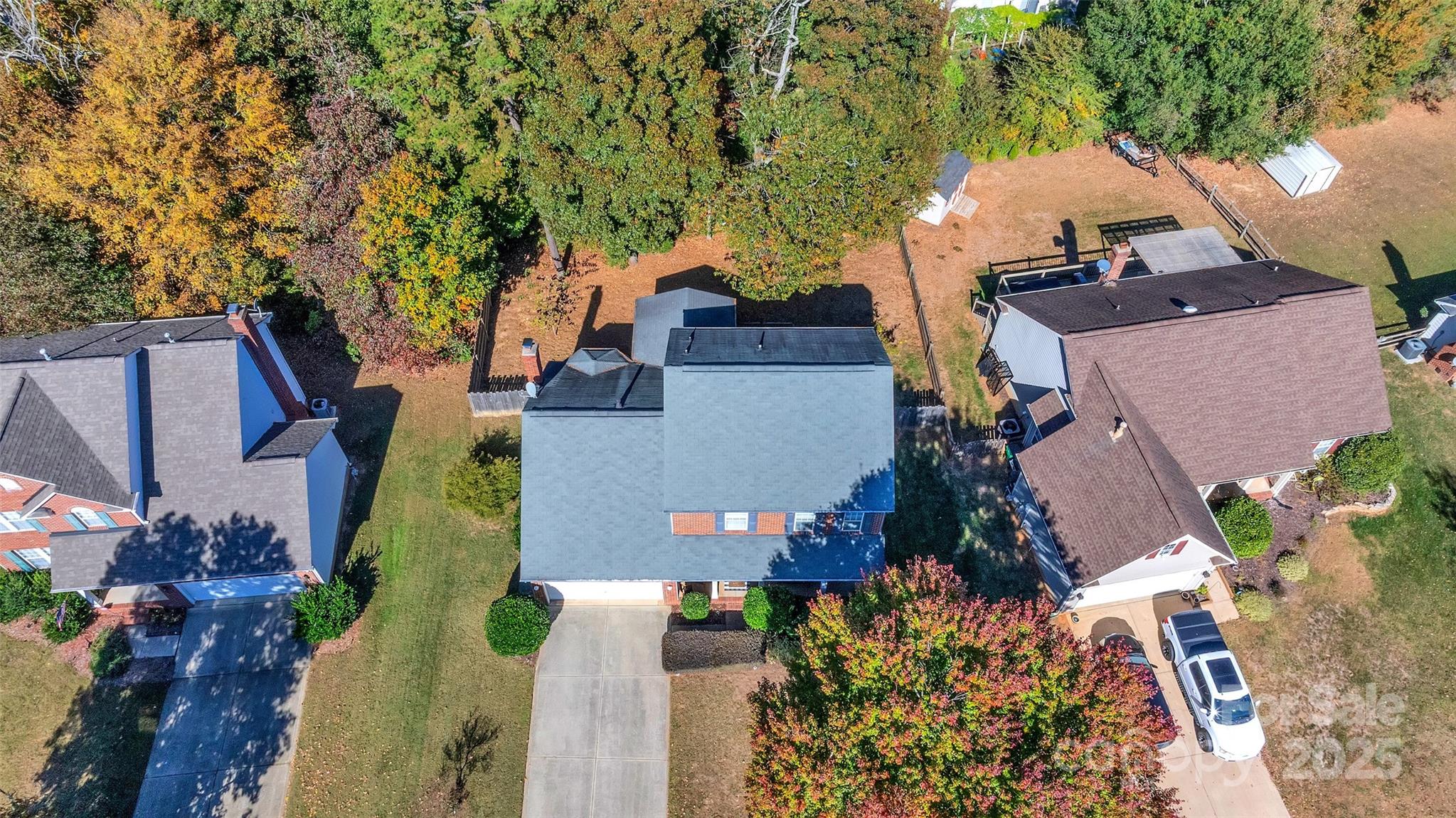 12351 Cardinal Point Road Charlotte, NC 28269 - Photo 2 of 43 an aerial view of a house with a yard and trees