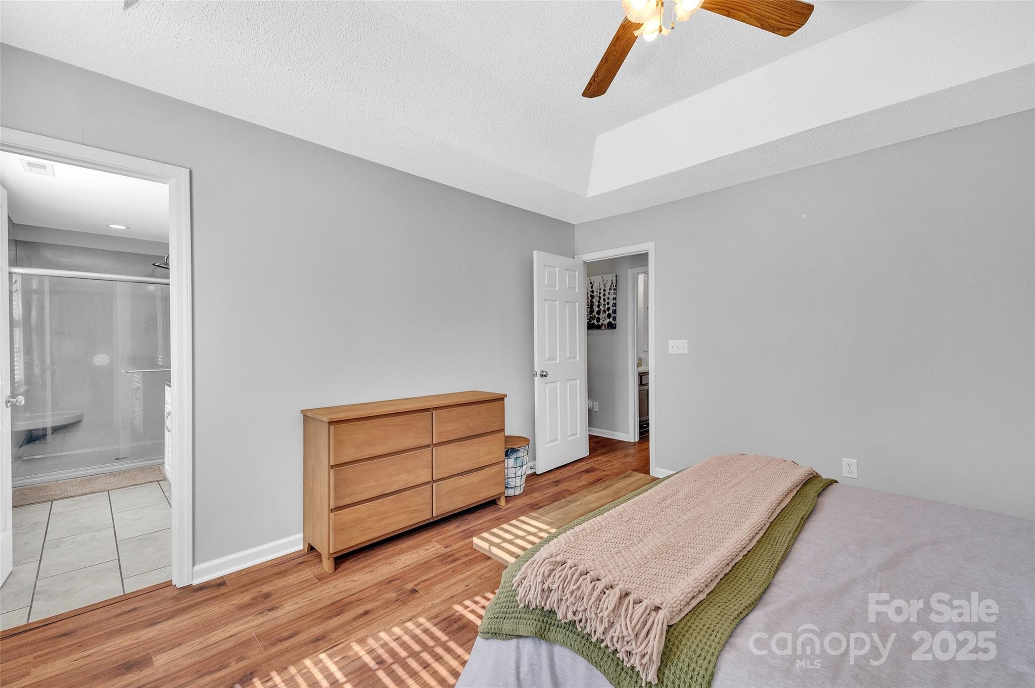 12351 Cardinal Point Road Charlotte, NC 28269 - Photo 25 of 43 a bedroom with a bed and a dresser
