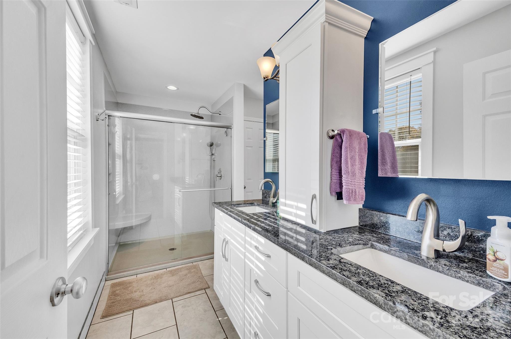 12351 Cardinal Point Road Charlotte, NC 28269 - Photo 27 of 43 a bathroom with double vanity and a shower