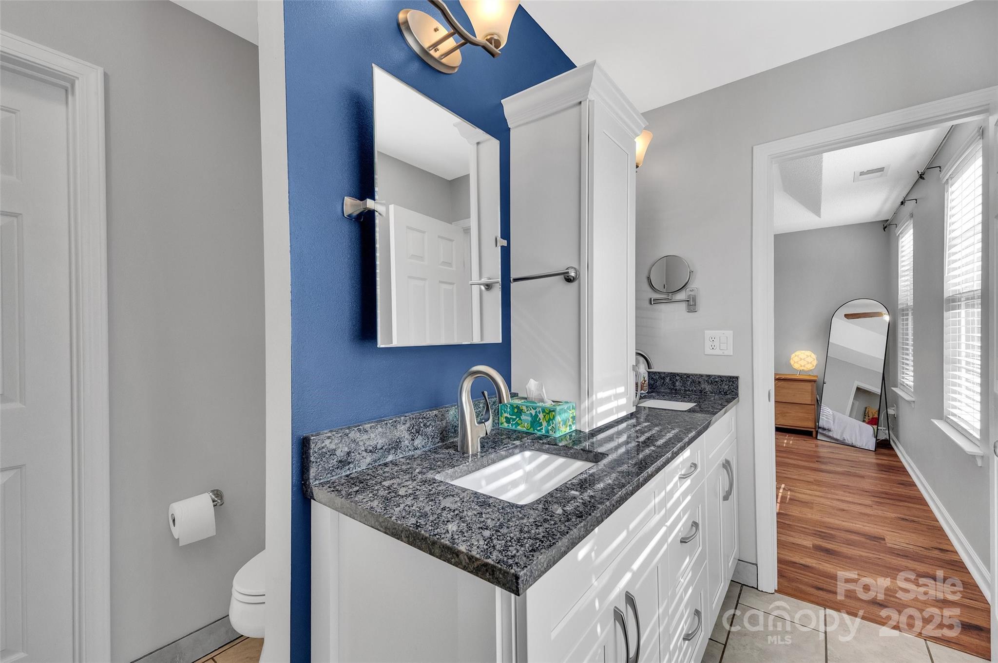 12351 Cardinal Point Road Charlotte, NC 28269 - Photo 29 of 43 a bathroom with a granite countertop sink and a mirror