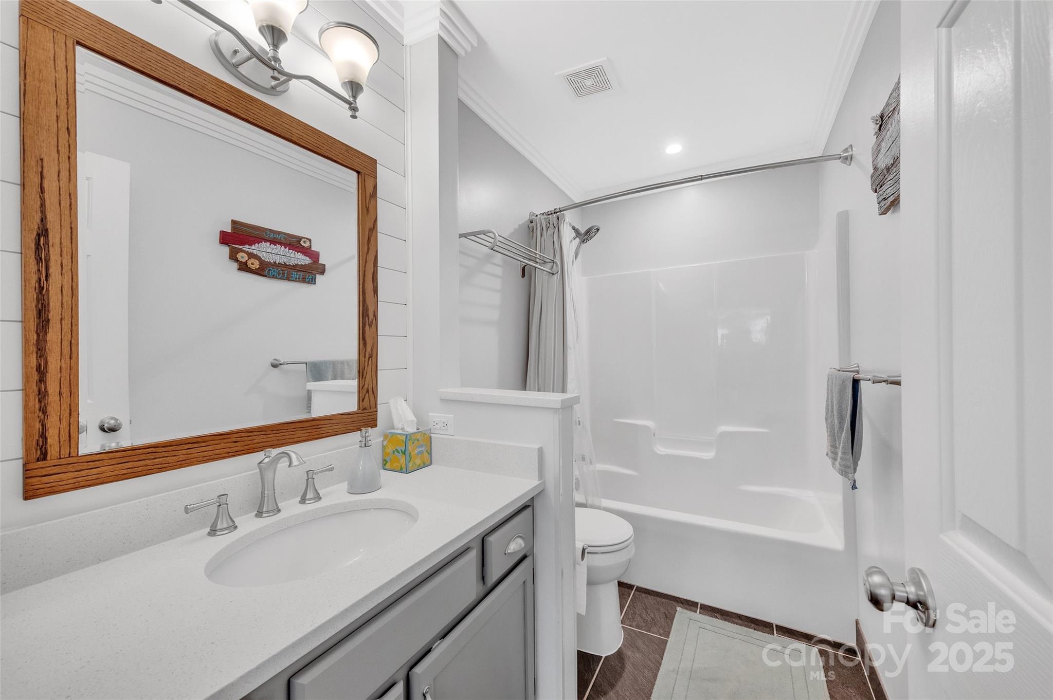 12351 Cardinal Point Road Charlotte, NC 28269 - Photo 32 of 43 a bathroom with a sink mirror toilet and bathtub