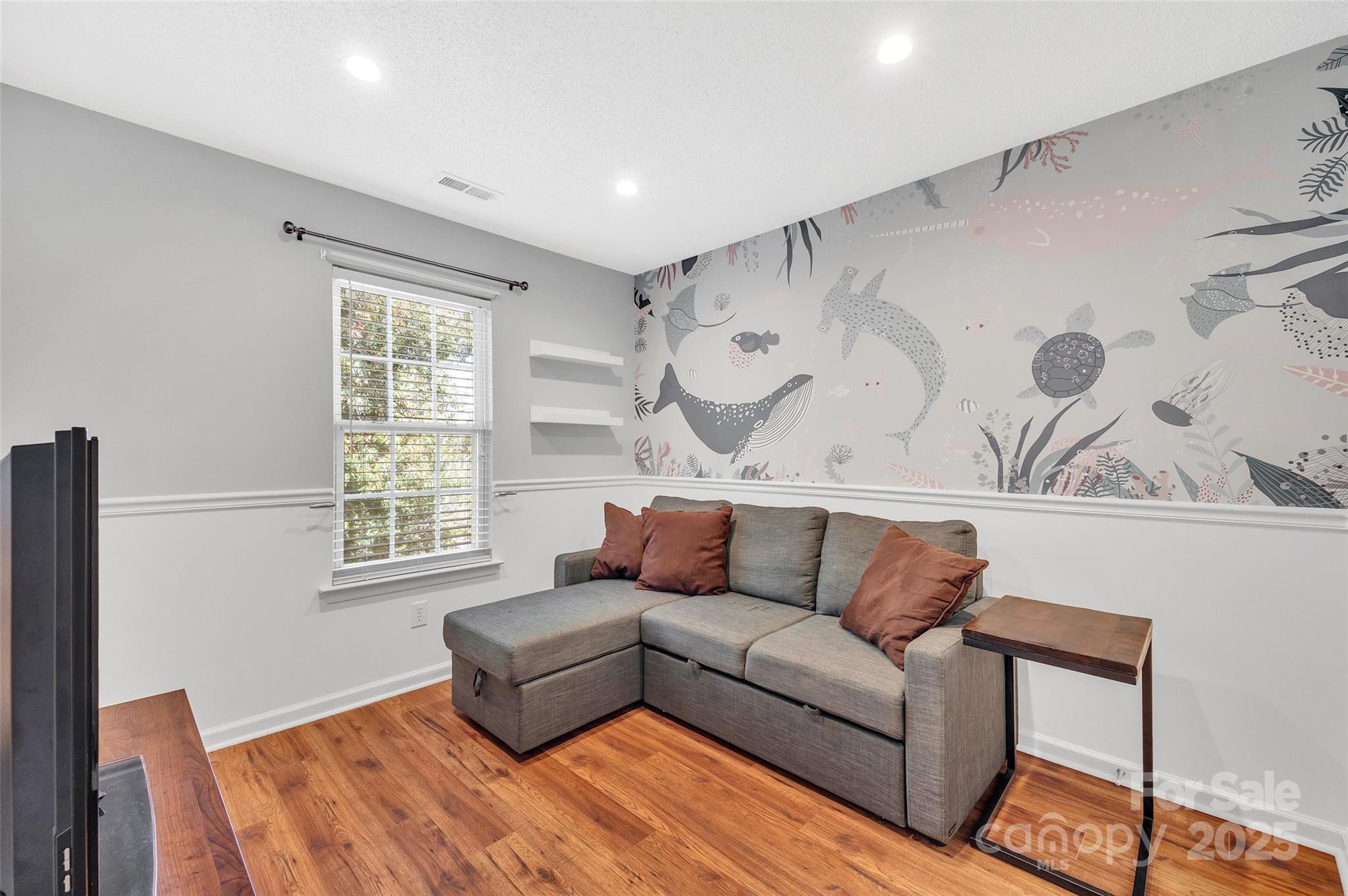 12351 Cardinal Point Road Charlotte, NC 28269 - Photo 33 of 43 a living room with furniture and a window
