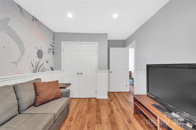 a work room with furniture and wooden floor