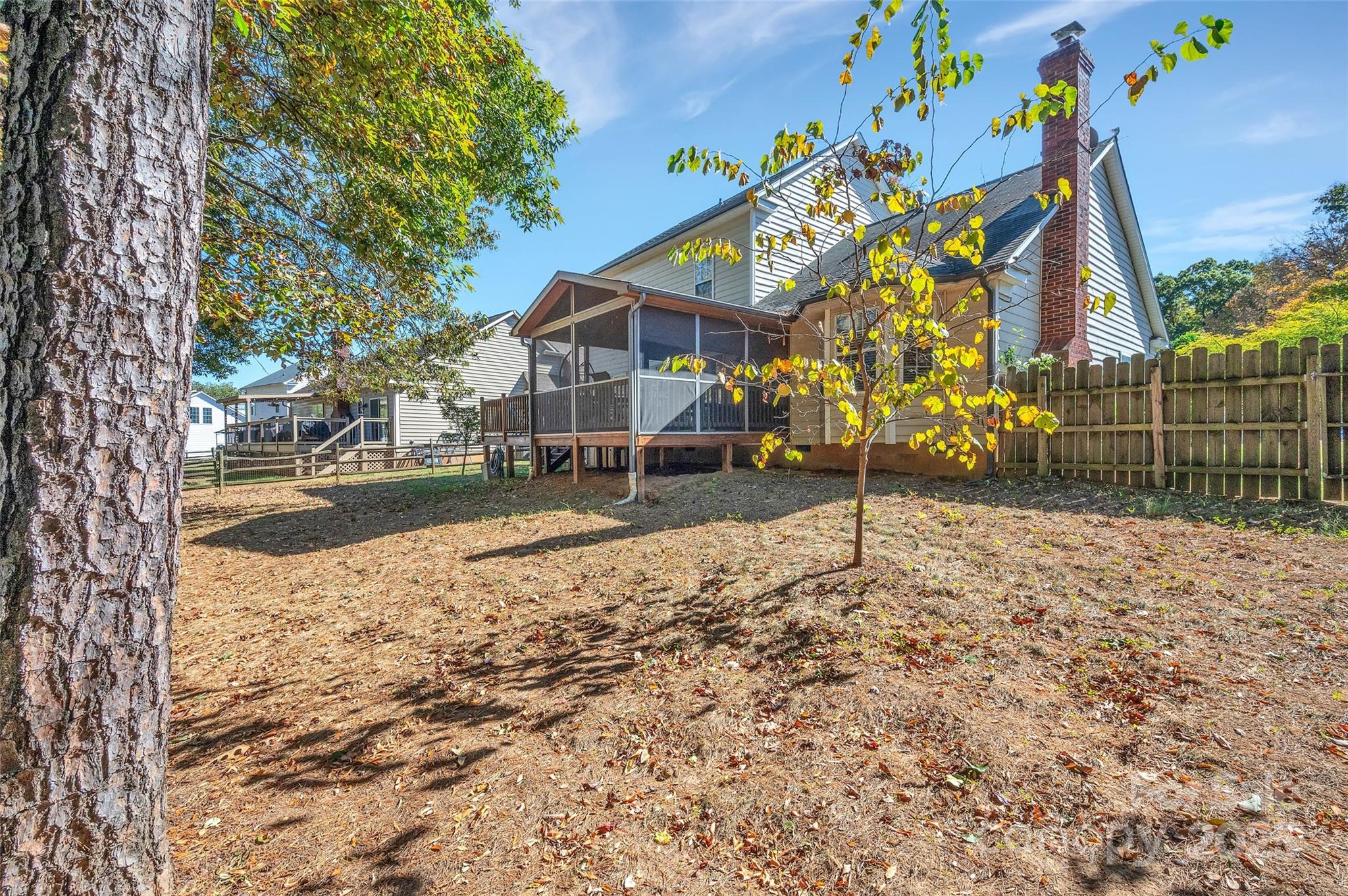 12351 Cardinal Point Road Charlotte, NC 28269 - Photo 39 of 43 a backyard of a house with lots of green space