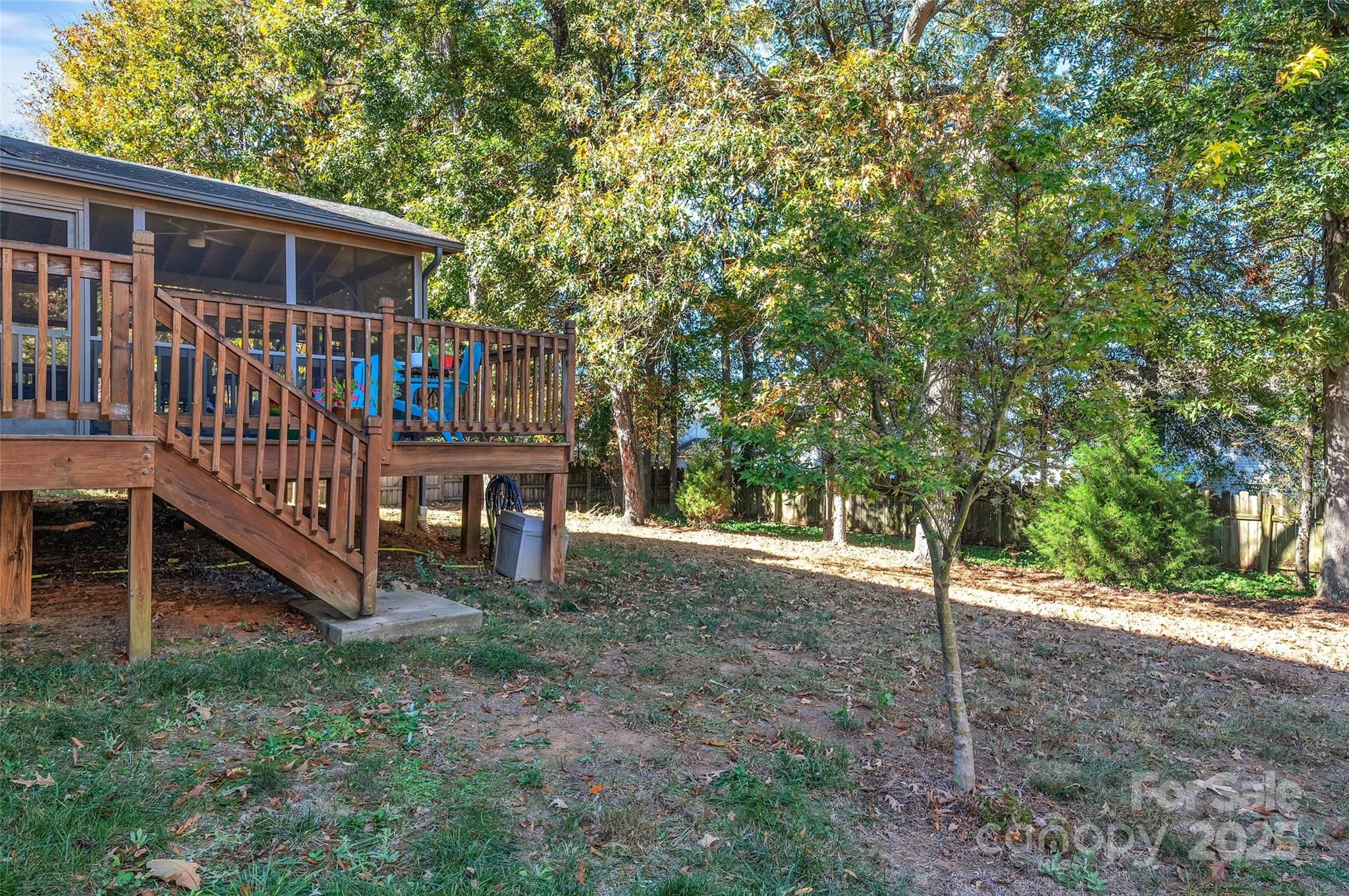 12351 Cardinal Point Road Charlotte, NC 28269 - Photo 41 of 43 a view of backyard with deck and a forest