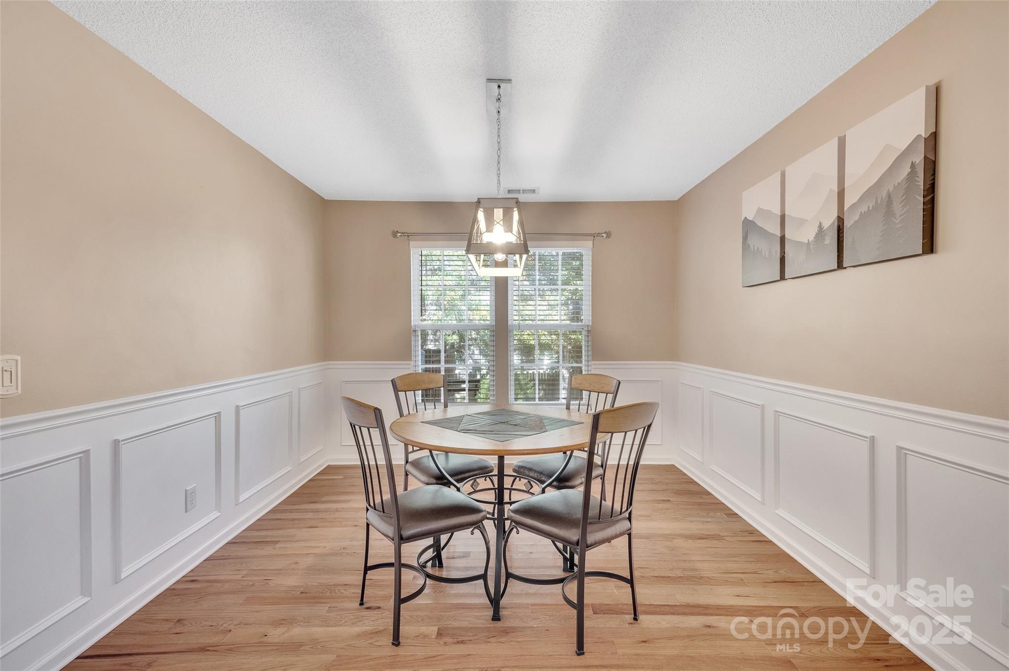 12351 Cardinal Point Road Charlotte, NC 28269 - Photo 10 of 43 a view of a dining room with furniture window and wooden floor