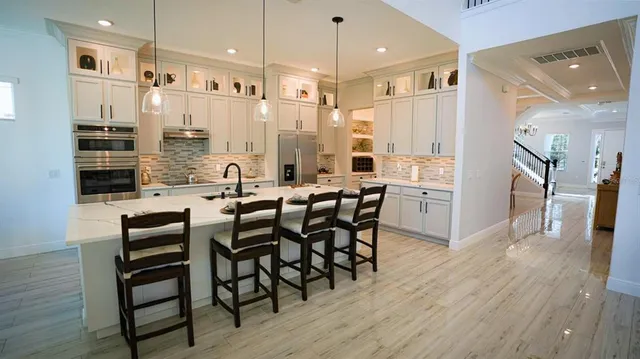 a spacious bedroom with a bed and a window