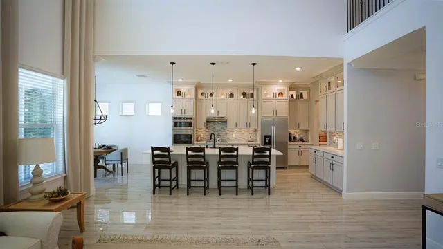 a living room with a bed and a dresser