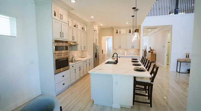 a view of a dining room with furniture and a table