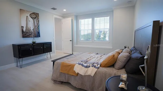 a bedroom with a bed and a closet