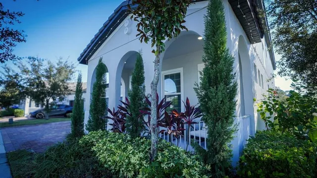 a backyard of a house with barbeque oven