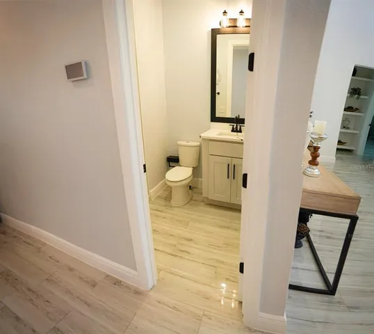 a large kitchen with a table and chairs