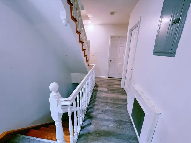 a dining room with furniture and a potted plant