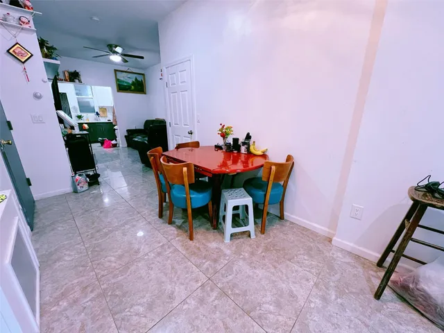 a bathroom with a granite countertop sink mirror vanity and toilet