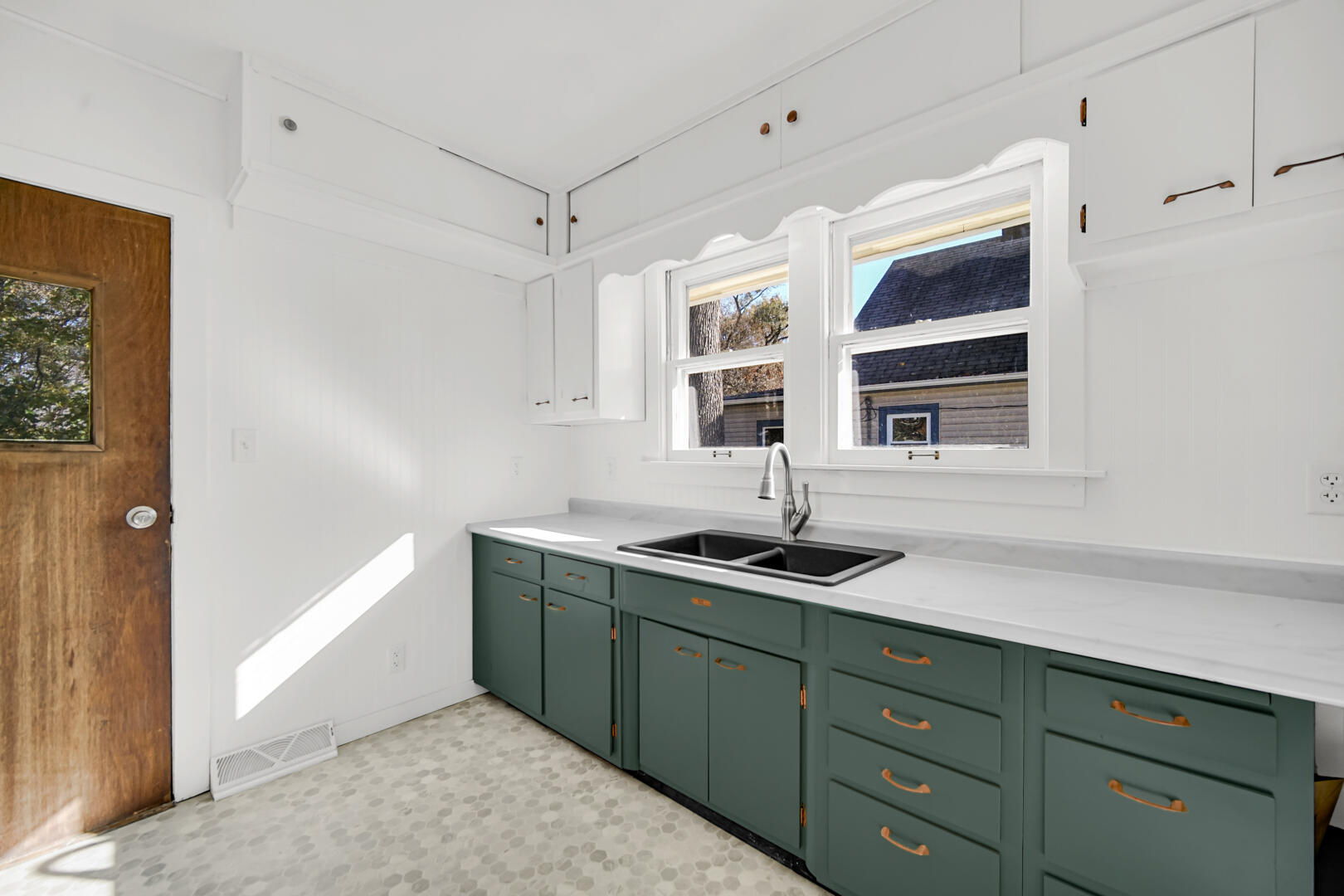 609 Main Street Hobart, IN 46342 - Photo 14 of 18 a kitchen with a sink and a window