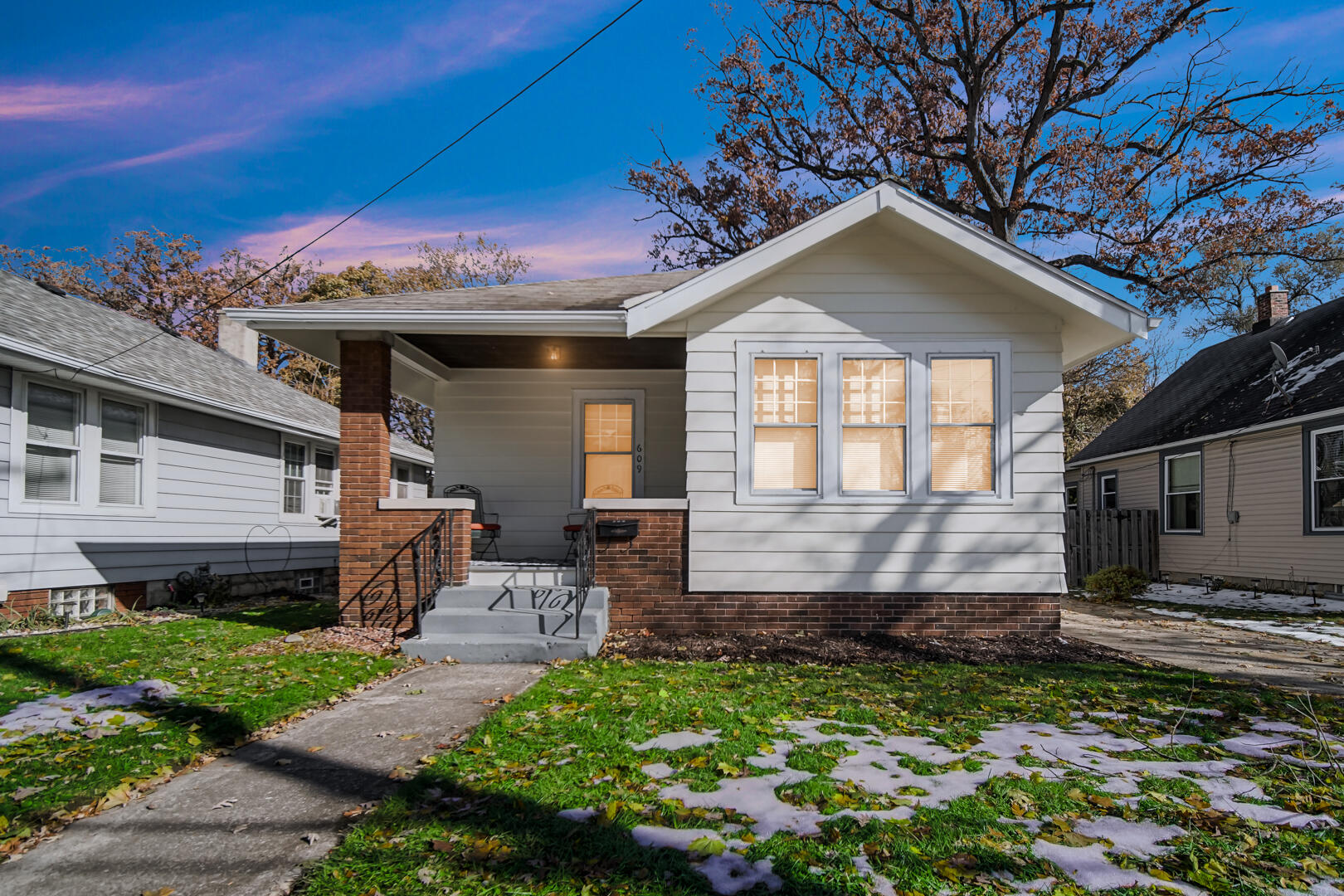 609 Main Street Hobart, IN 46342 - Photo 2 of 18 a front view of a house with a yard