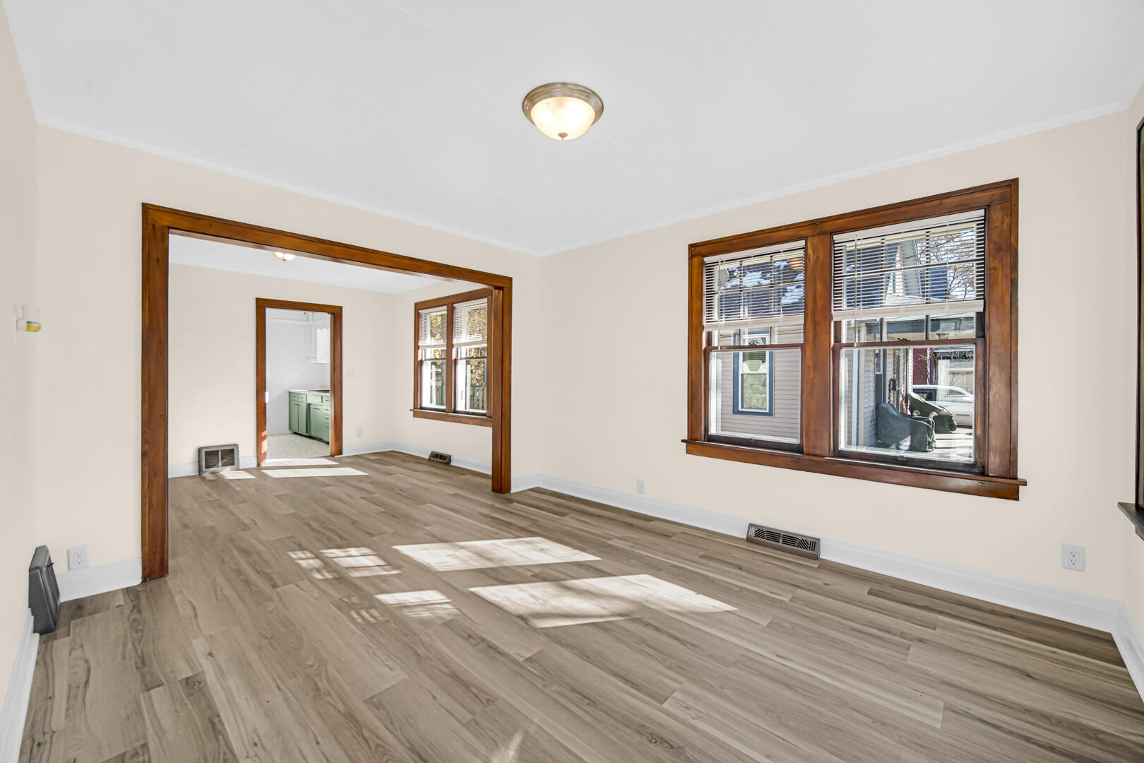 609 Main Street Hobart, IN 46342 - Photo 4 of 18 a view of a room with wooden floor and a window