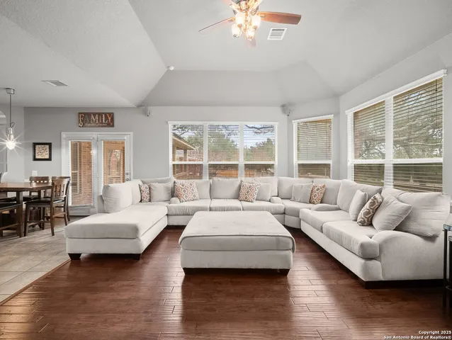 a living room with furniture and a large window