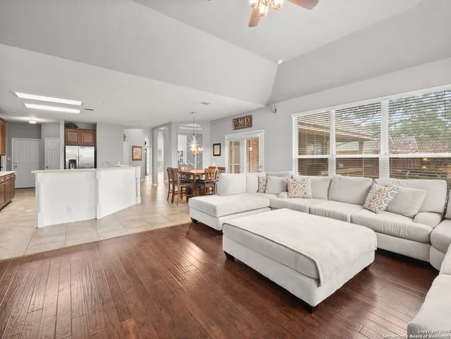 a living room with furniture and a large window