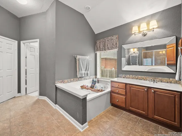 a kitchen with a stove a sink and a refrigerator