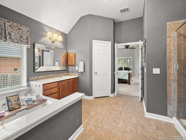 a kitchen with stainless steel appliances a refrigerator and stove